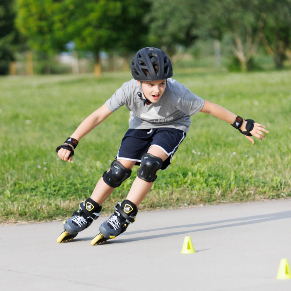 Rollerblade-APEX-Junior-Adjustable-Inline-Skate-Charcoal-Yellow-Lifestyle-View