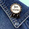 JUBLY-UMPH-Bad-Influence-Lapel-Pin-On-Collar