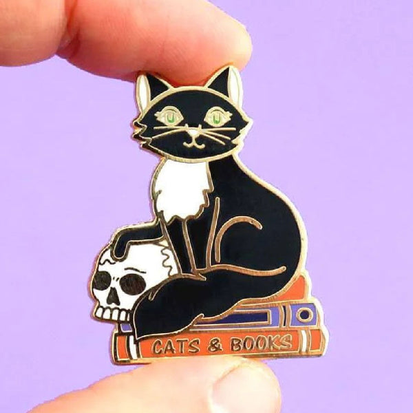 JUBLY-UMPH-Cats-And-Books-Lapel-Pin-between-fingers