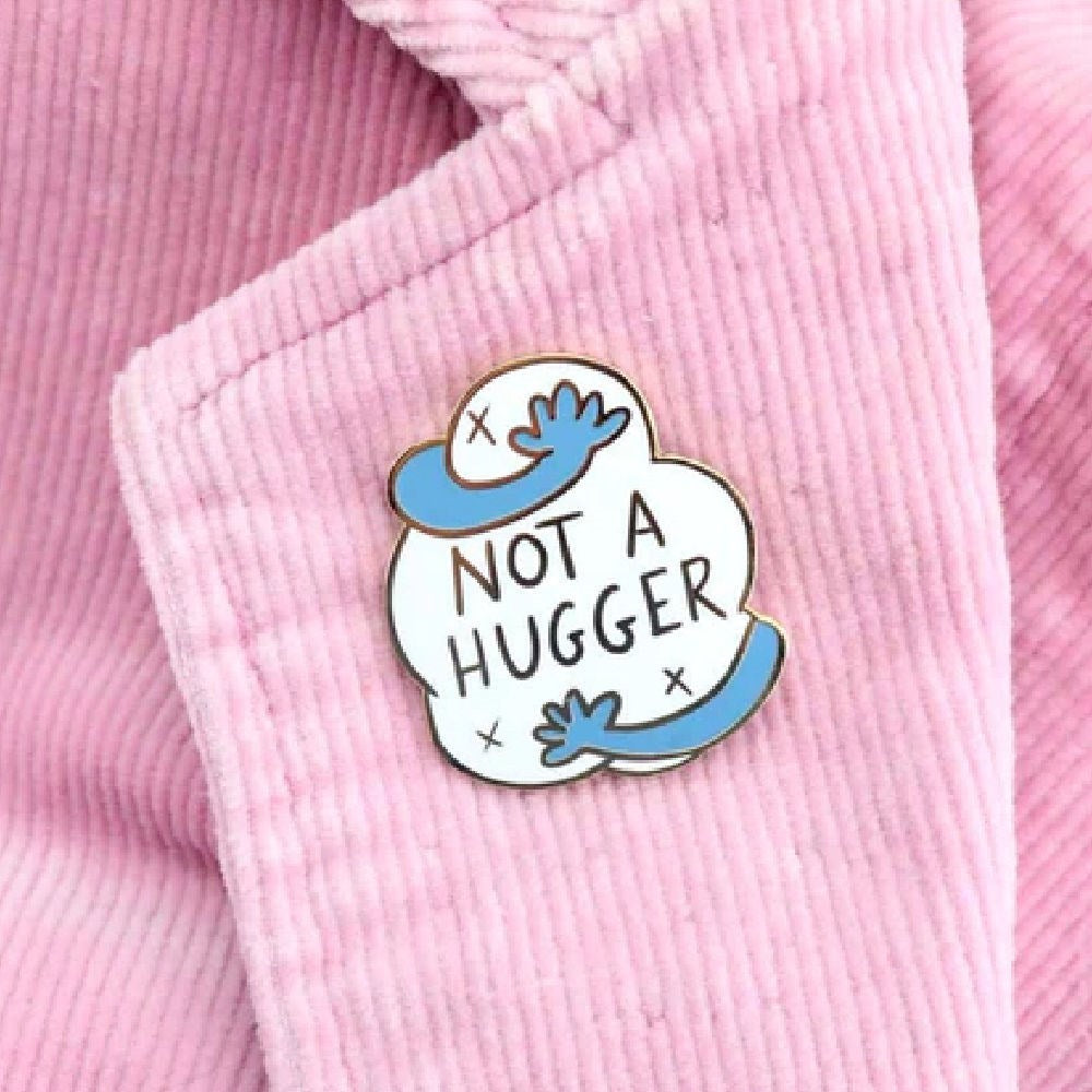 JUBLY-UMPH-Not-A-Hugger-Lapel-Pin-On-Collar