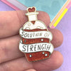 JUBLY-UMPH-Solution-Of-Strength-Lapel-Pin-On-Fingers