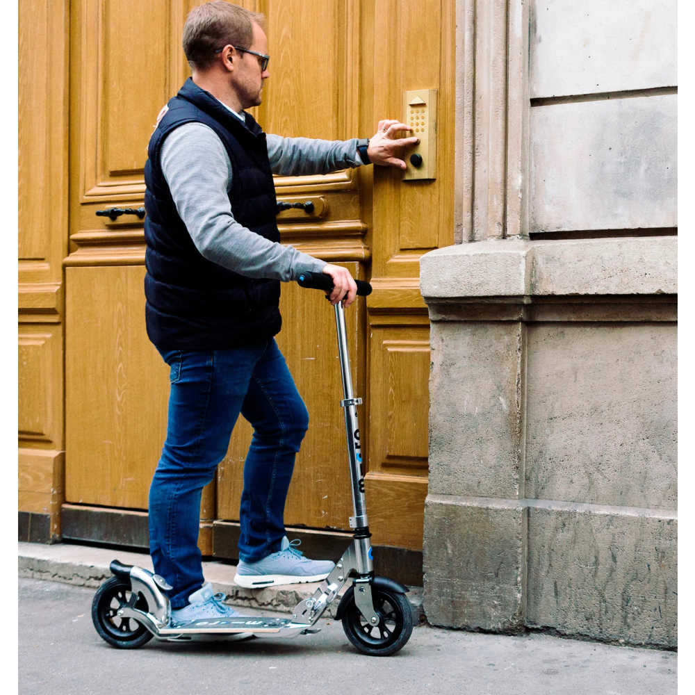 MICRO-Flex-Air-Scooter-Man-On-Scooter