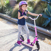 girl-riding-her-micro-scooter-cruiser-pink